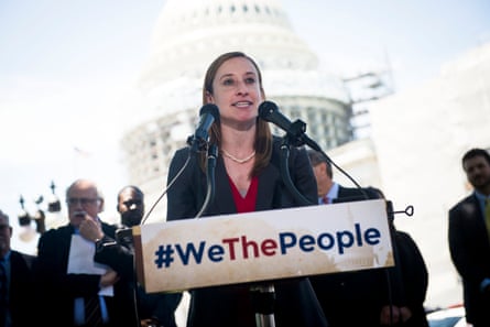 a women in front of microphones