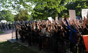 Protestors peacefully protest minutes before riot police cleared them away for a photo opportunity by Donald Trump.