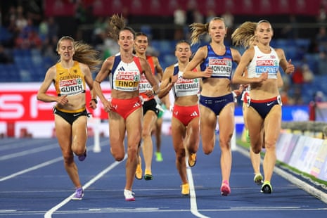 Elise Thorner (right) crosses the finish line to win her 3000m steeplechase heat.