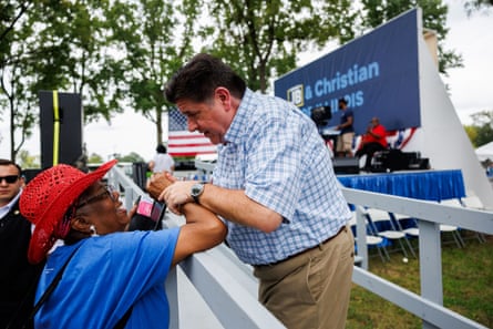 JB Pritzker speaks with a supporter