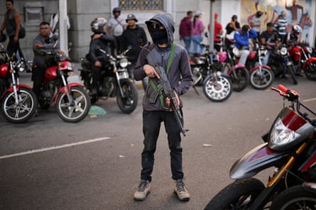A member of colectivos takes part in a march calling for the release of Maduro.