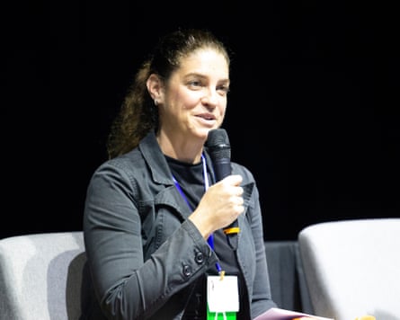 Bethanie Carney Almroth is sitting on a chair and holding a microphone during a talk