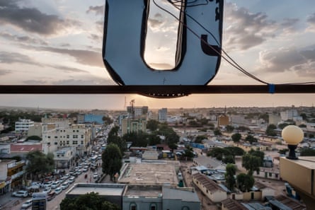 A view over a city with mostly low rise buildings.