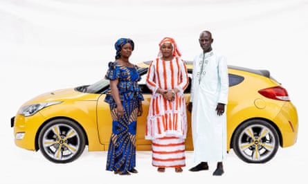 Commercial agent Anta, massage therapist Anna, estate agent Amadou with a yellow Hyundai in Somone, Senegal