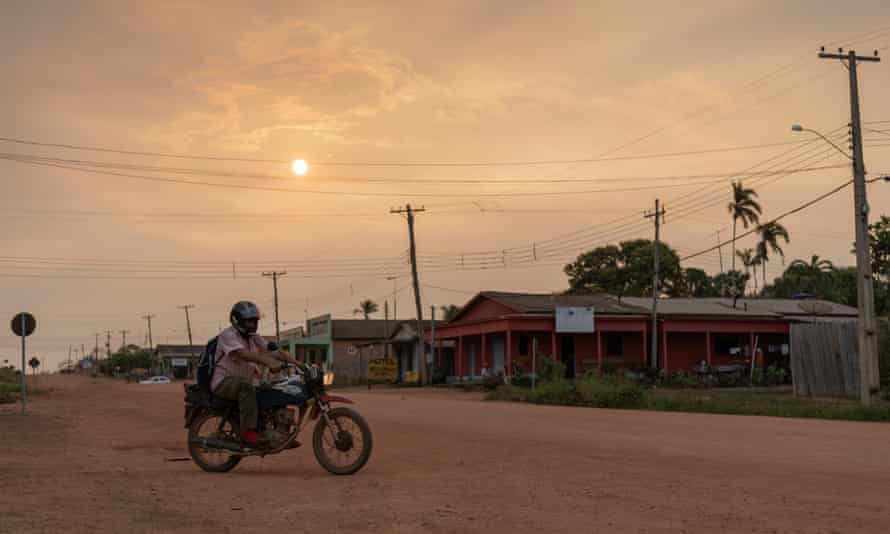 Main street of the small village of Palmeiras. The orange sun indicates the amount of smoke in the air.