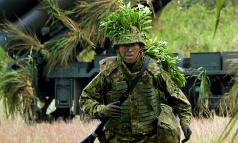 A Japanese soldier in full battledress and foliage camouflage