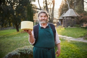 Eco-activist and farmer Simon Fairlie is photographed with his cheese for the Observer mmagazine.