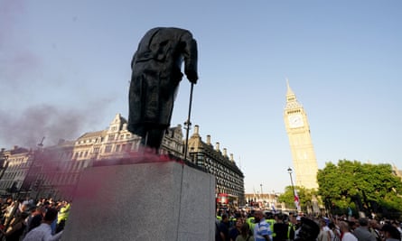 Red flare dust billowing from the side of the Winston Churchill statue, with Big Ben in the background