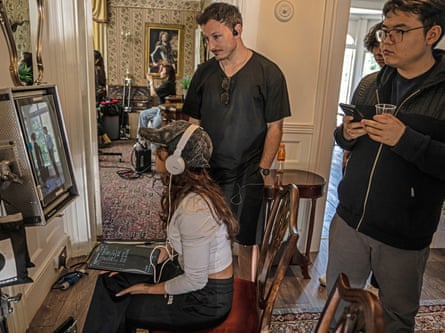 A film crew watching back footage on a vertical screen on a film set