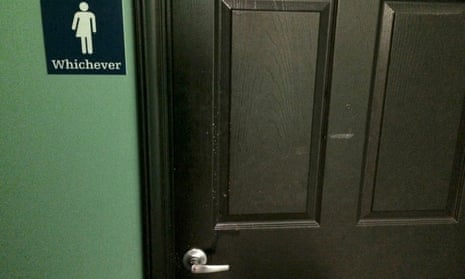 A bathroom sign welcomes both genders at a restaurant in Durham, North Carolina May 5, 2016.