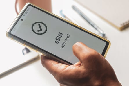 A person installing an esim on a mobile phone