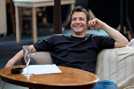 Thompson at the rehearsals for The Lives of Others. Sitting in an armchair and grinning.