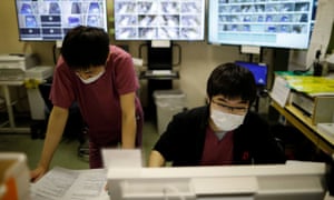 Medical workers wear protective face masks as they work at the Intensive Care Unit (ICU) ward for coronavirus disease (COVID-19) patients at St. Marianna Medical University Hospital in Kawasaki, south of Tokyo, Japan May 4, 2020. REUTERS/Issei Kato