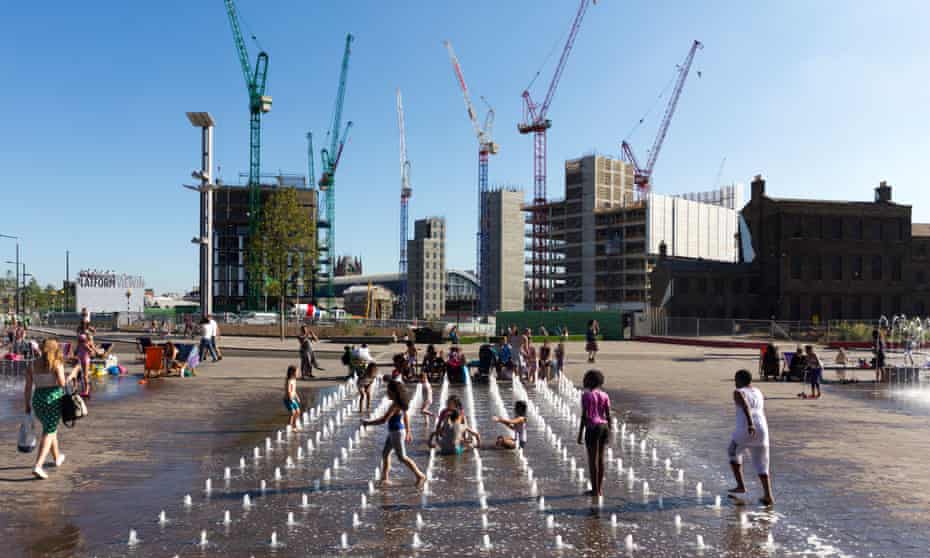 Children play in fountains during a heatwave in Kings Cross, London
