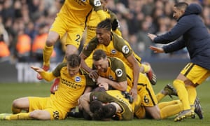 Brighton players celebrate winning in the penalty shootout – their manager Chris Hughton will have felt the match should have got that far.