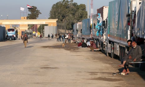 A Gaza-bound humanitarian aid convoy parked outside the Rafah border gate in Egypt on Thursday, a day before the Israel-Hamas truce ended and fighting resumed