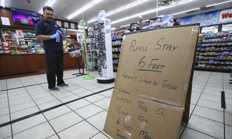Ejaz Tarar stands next to his makeshift sign at the Food Mart in Newton county, Georgia on Thursday.