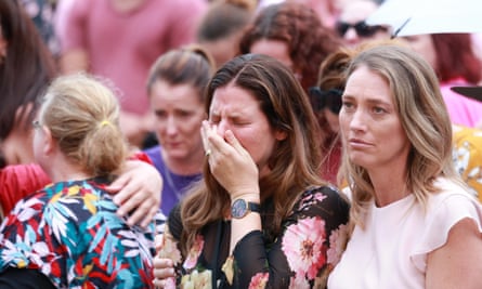 woman cries at vigil for Hannah Clarke