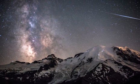 The Milky Way towers above the 4,392m peak of Mount Rainier in Washington, USA