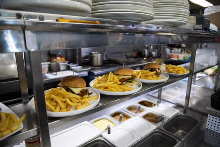 Burgers are served in the kitchen of the Royal Federal Hotel