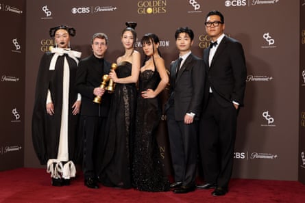 The KPop Demon Hunters team with their two Golden Globe awards