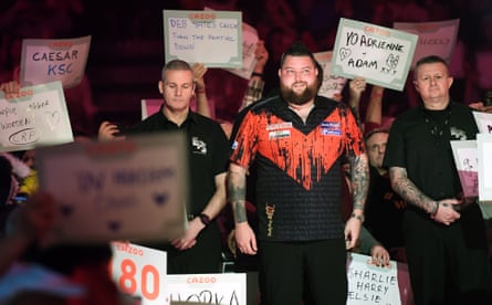 Michael Smith prepares to walk to the stage for the PDC World Darts final against Michael van Gerwen at Alexandra Palace in January