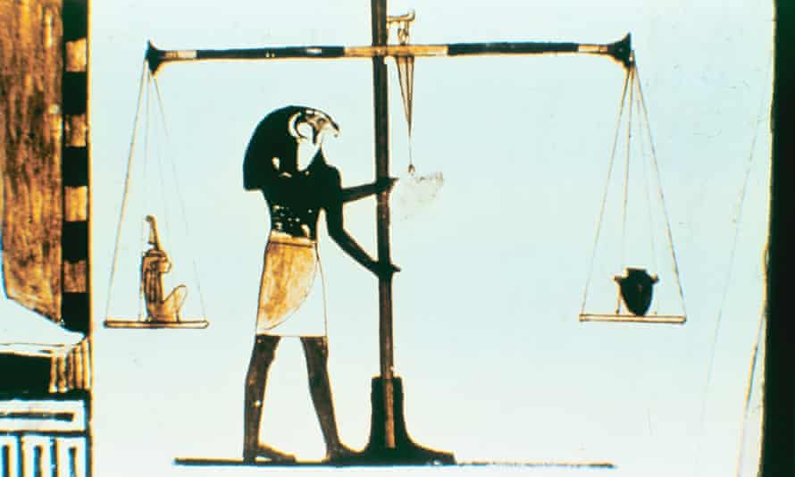 The ancient Egyptian god Horus weighing the heart of the dead in a balance, in an image from the 28th dynasty, dating from around 400 BC.