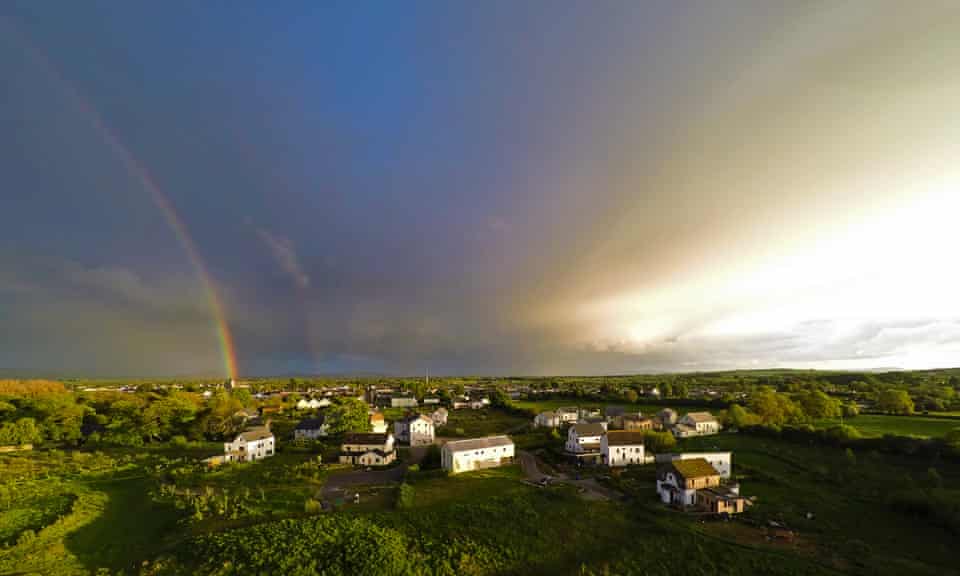 A rainbow appears over the Cloughjordan eco-village in Tipperary, Ireland. 