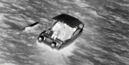 A boat and a kayak in black and white.