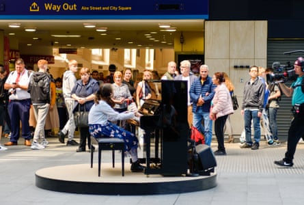 Lucy performing at Leeds train station.