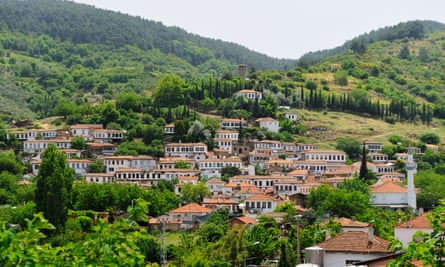 Şirince is set against forested slopes.