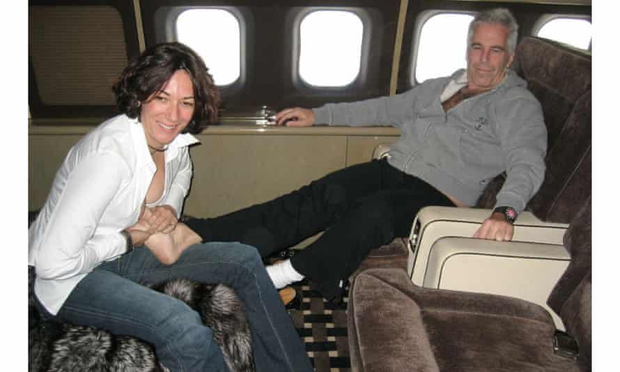 Maxwell massaging Epstein’s feet on his jet.