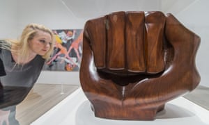 A woman looks at the sculpture Black Unity 1968, by Elizabeth Catlett, in the Soul of a Nation exhibition.