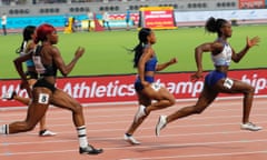 Dina Asher-Smith (right) of Britain sets the pace in her 200m heat at the world championships in Doha.