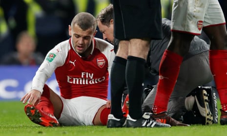 Arsenal’s Jack Wilshere receives medical attention.