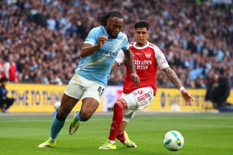 Antoine Semenyo of Manchester City beats Piero Hincapie of Arsenal.