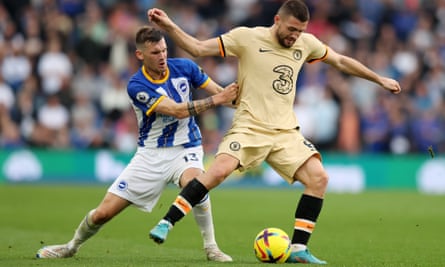 Chelsea’s Mateo Kovacic of Chelsea is challenged by Brighton’s Pascal Gross