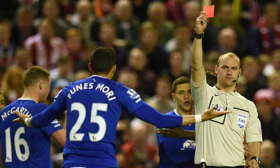 Bobby Madley shows Everton’s Ramiro Funes Mori a red card during a Merseyside derby at Anfield in April 2016