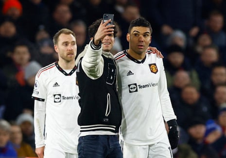 Casemiro’s too polite to refuse a selfie with a pitch invader.