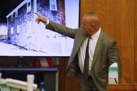 a man pointing to a screen