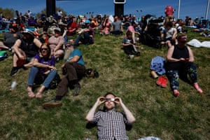 people sit outside ahead of an eclipse