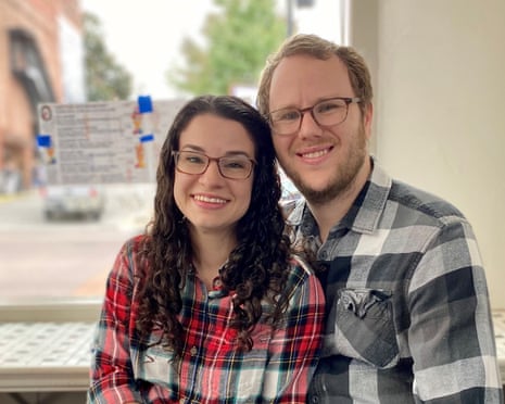 man and woman wearing plaid shirts and glasses