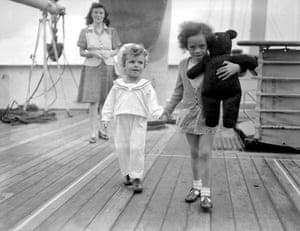 On board the HMT Empire Windrush at Tilbury Docks, June 1948Terence (three years old) and Maureen (four and a half years old) Johnson, with their mother Eileen Johnson (24 years old)the black teddy is a “Titanic Commemoration bear”. These bears were made in memory of those who died when the Titanic sank in 1912.