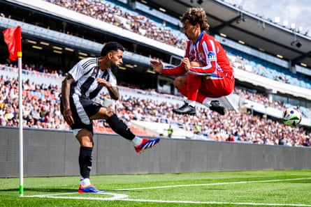 Douglas Luiz beats Antoine Griezmann to the ball during Juventus’ pre-season match with Atlético Madrid.