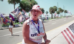 A supporter waves the flag for Trump in Florida.