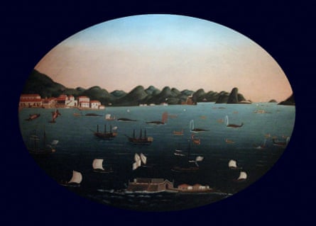 A naive-style of painting in an oval frame showing boats and ships in a bay surrounding whales, one of which is spouting blood