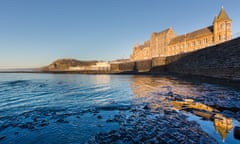 old college and sea cover the rocks