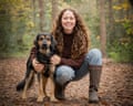 Mirelle poses with her dog Paddy on a forest path