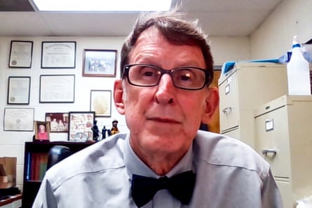 A man in a bowtie during a zoom call