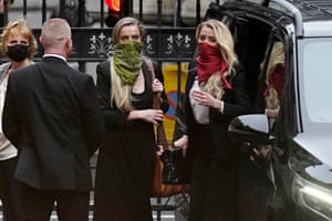 London, England. Amber Heard, right, arrives on the third day of the libel trial by her former husband, Johnny Depp, against the Sun at the high court